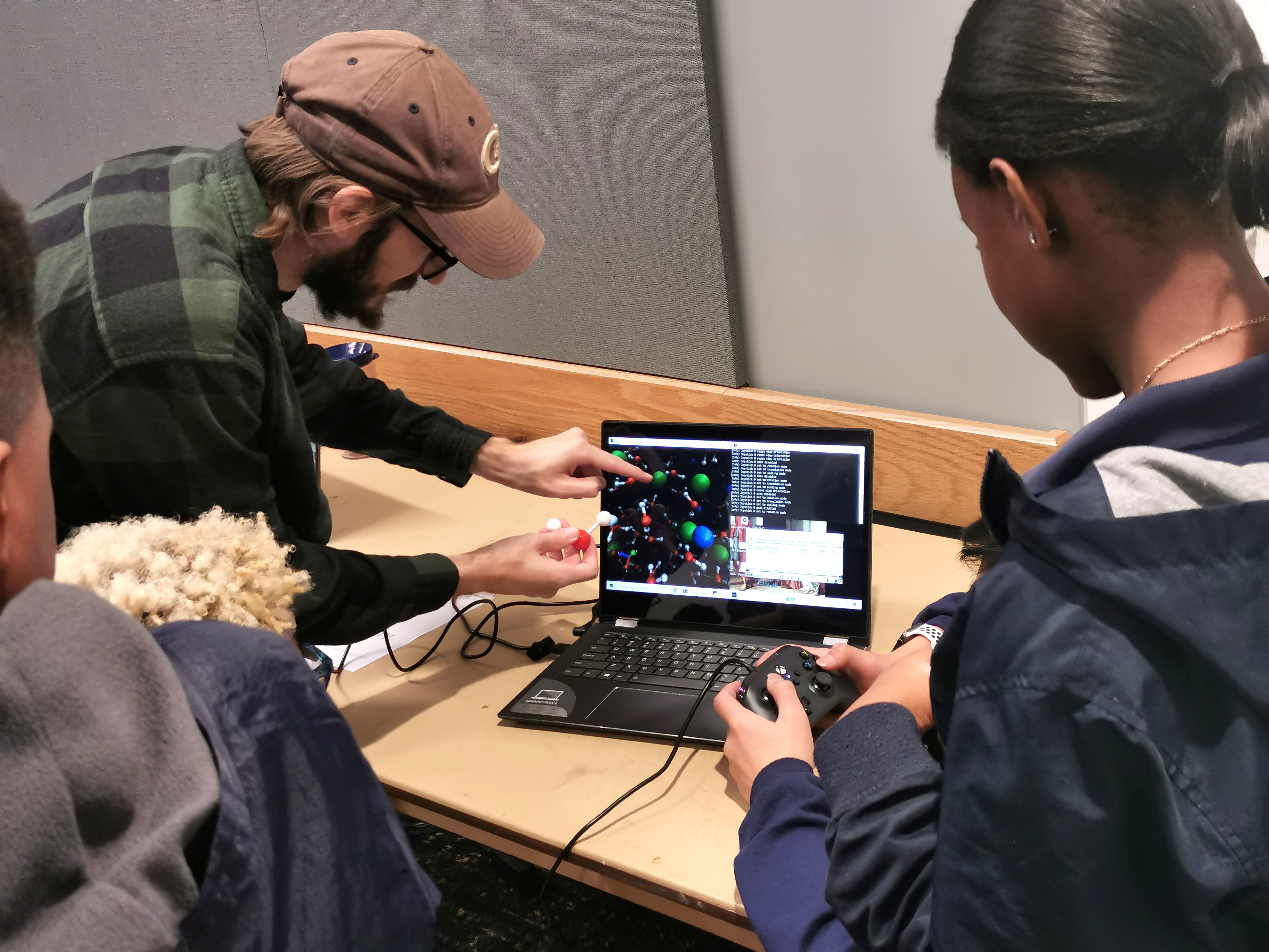 John Hymel working with students on a computational chemistry project.