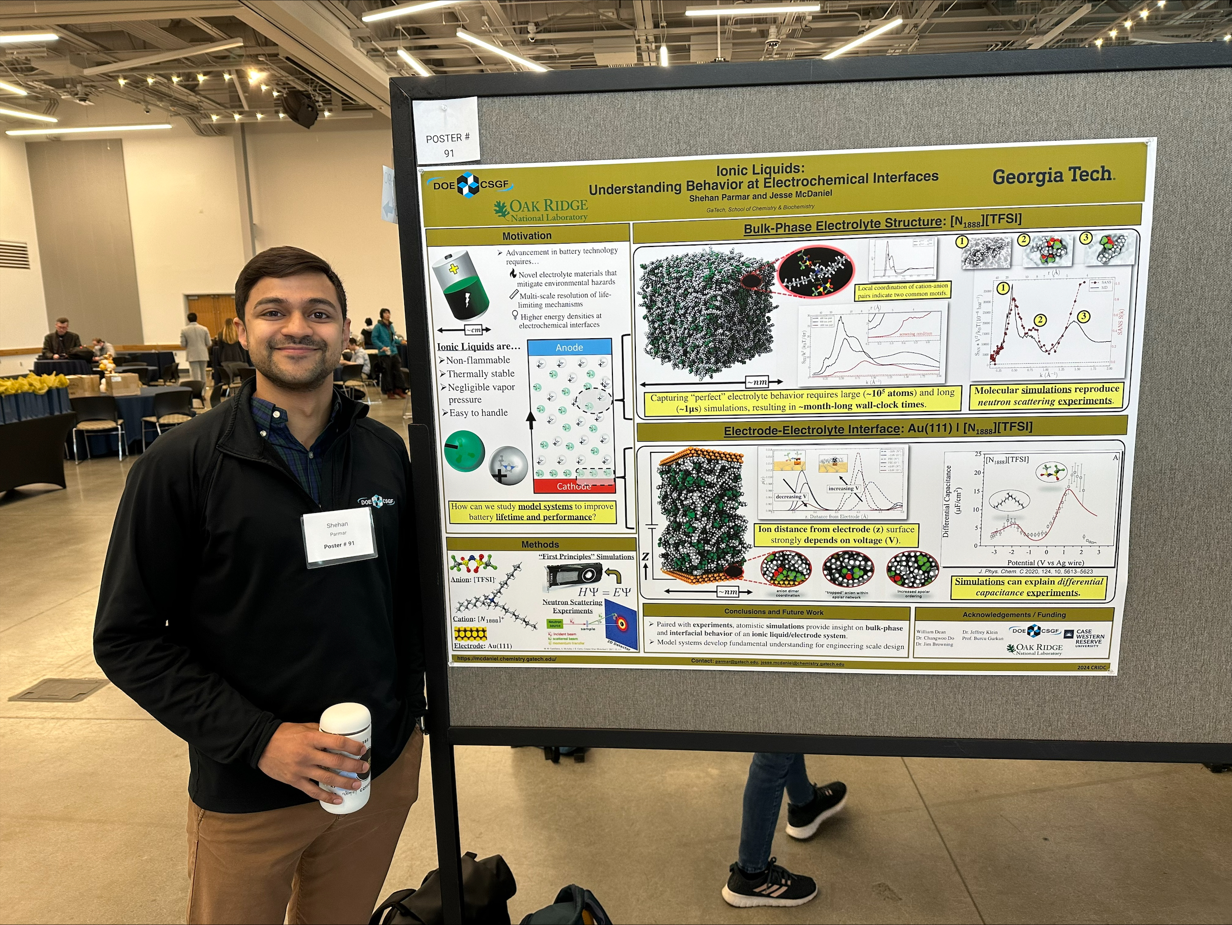 Shehan Parmar with his award-winning poster on theoretical studies of ionic liquids.