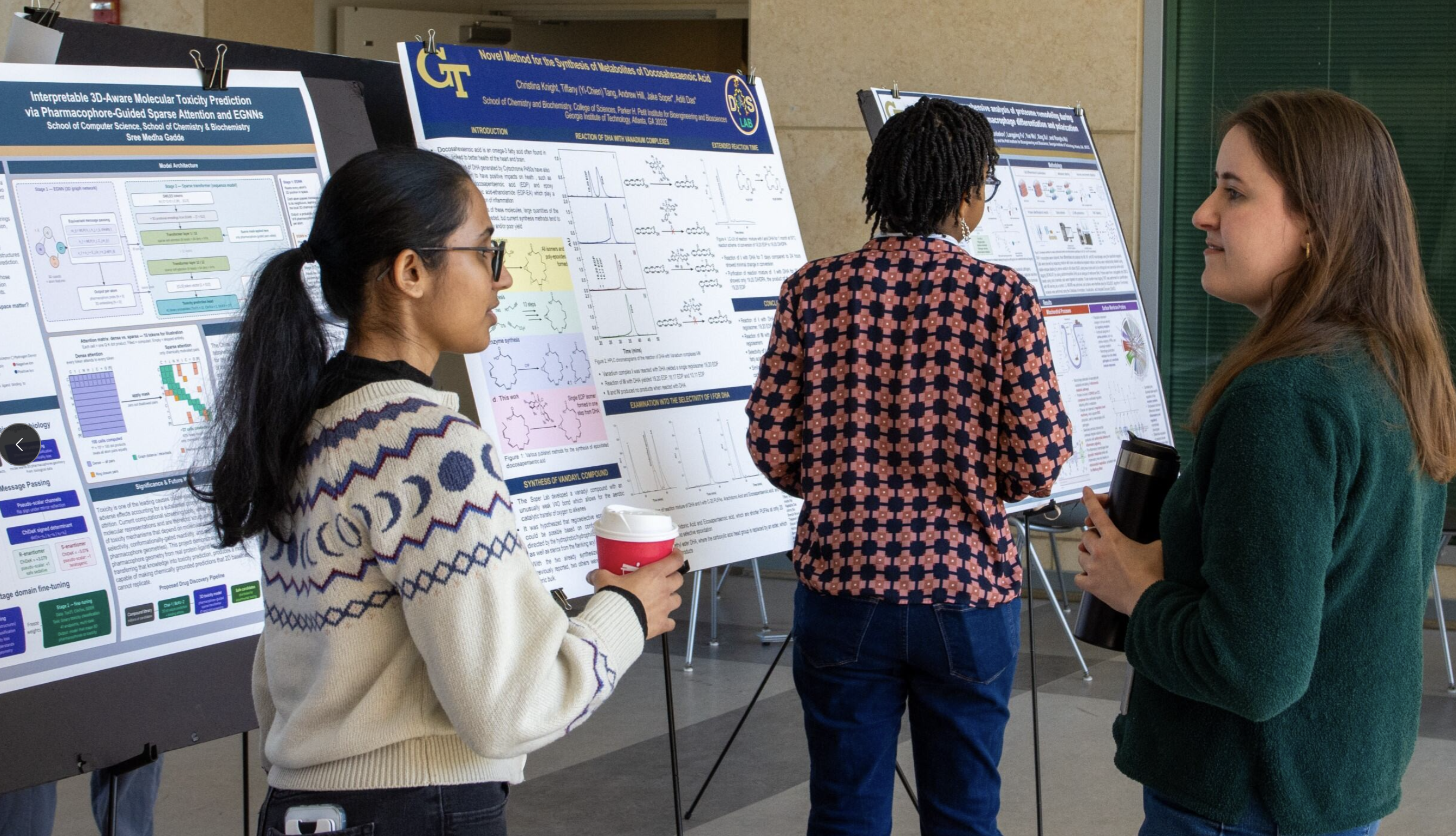 A presenter and attendee at the research showcase.